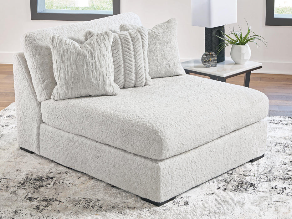 Ashley Furniture Cuddle Plush sectional with chaise, plush fabric, and modern design, shown in a cozy living room setting.