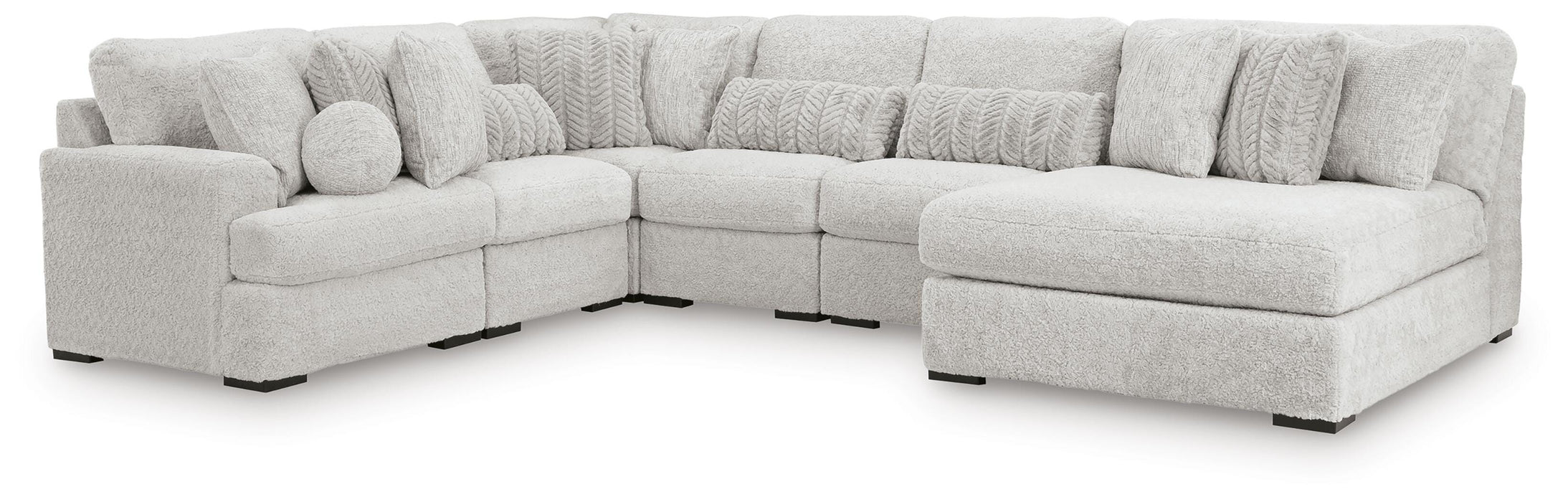 Ashley Furniture cuddle plush sectional with chaise, featuring soft fabric and a comfortable, inviting seating arrangement.