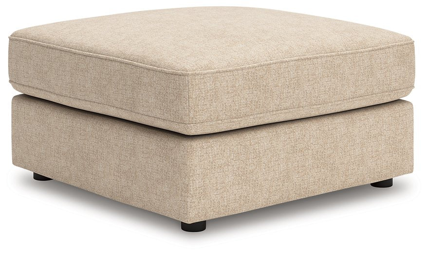 Ashley Furniture Seyler oversized accent ottoman with plush fabric and stylish design, shown from an angled perspective.