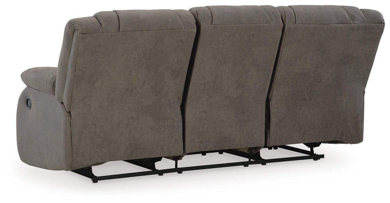 Ashley Furniture First Base reclining sofa with plush cushions and fabric upholstery, shown from the back view.