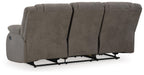 Ashley Furniture First Base reclining sofa with plush cushions and fabric upholstery, shown from the back view.