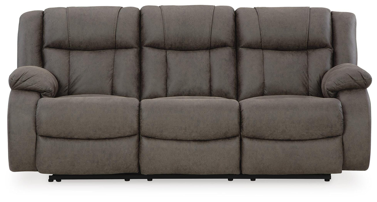Ashley Furniture First Base reclining sofa with plush cushions and fabric upholstery, shown from a front head-on view.