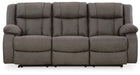 Ashley Furniture First Base reclining sofa with plush cushions and fabric upholstery, shown from a front head-on view.