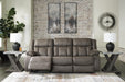 Open view of Ashley Furniture First Base Reclining Sofa showcasing plush cushions and reclining features in a modern living room setting.