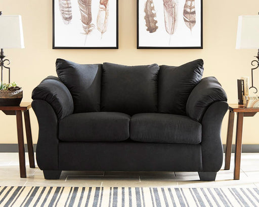 Ashley Furniture Darcy loveseat with plush beige upholstery and cushioned armrests, perfect for cozy living room seating.