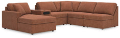 Ashley Furniture Modmax sectional with chaise, featuring plush fabric upholstery and modern design, shown in a living room setting.