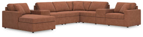 Ashley Furniture Modmax sectional with chaise, showing modern fabric upholstery and spacious seating arrangement.