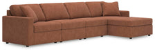 Ashley Furniture Modmax sectional with chaise, shown in a modern fabric with plush cushions and sleek design.