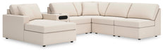 Ashley Furniture Modmax sectional with chaise, featuring plush upholstery and modern design, shown from a side angle.
