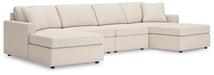 Ashley Furniture Modmax sectional with chaise, featuring plush upholstery and modern design in a stylish living room setting.