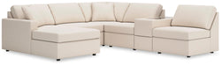 Ashley Furniture Modmax sectional with chaise, featuring plush cushions and modern design in a neutral fabric.