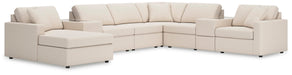 Ashley Furniture Modmax sectional with chaise, showing modern fabric upholstery and spacious seating in a stylish living room setting.
