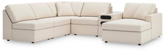Ashley Furniture Modmax sectional with chaise, beige fabric, modern design, featuring plush cushions and wide armrests.