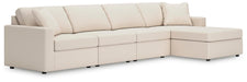 Ashley Furniture Modmax sectional with chaise, showing modern fabric upholstery and plush seating in a stylish living room setting.
