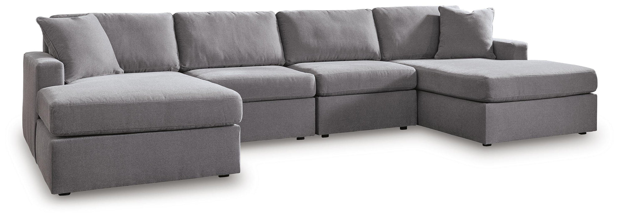Ashley Furniture Modmax sectional with chaise, featuring modern design, neutral fabric, and plush cushions in a stylish living room setting.