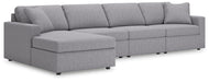 Ashley Furniture Modmax sectional with chaise, showing a modern fabric sofa with a spacious chaise lounge and angled view.