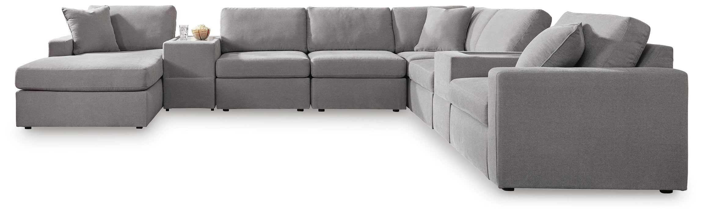 Ashley Furniture Modmax sectional with chaise, featuring modern upholstery and a spacious seating area.
