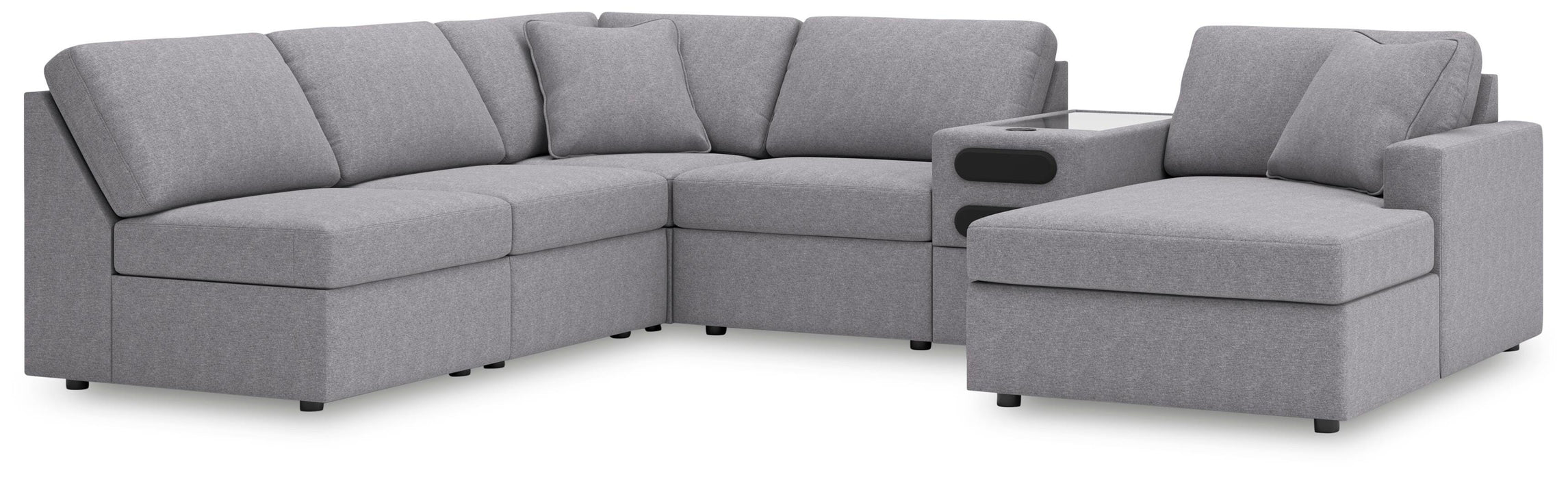 Ashley Furniture Modmax sectional with chaise, featuring modern upholstery and multiple cushions in a spacious living room setting.