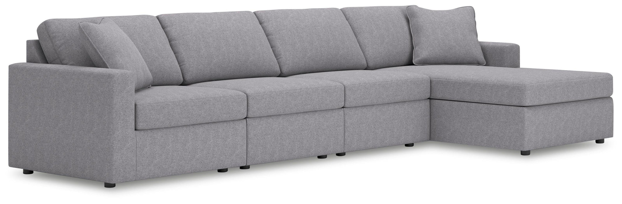 Ashley Furniture Modmax sectional with chaise, showing plush fabric upholstery and modern design in a spacious living room setting.