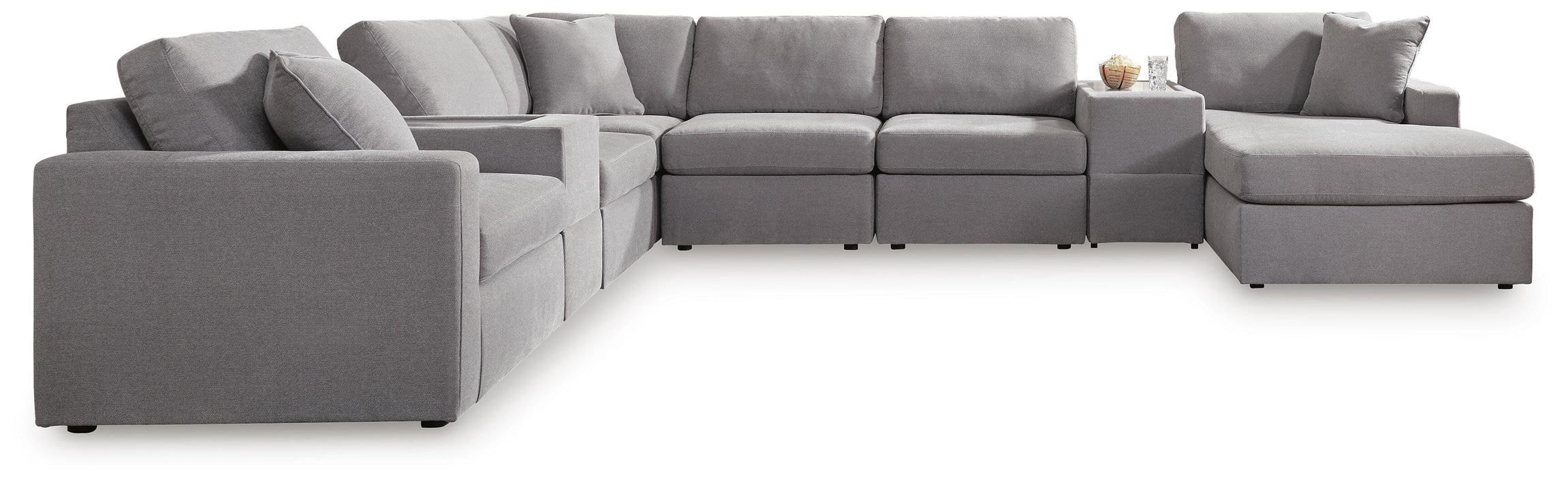 Ashley Furniture Modmax sectional with chaise, featuring modern upholstery and a spacious seating area.