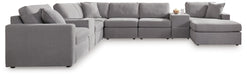 Ashley Furniture Modmax sectional with chaise, featuring modern upholstery and a spacious seating area.