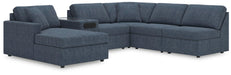Ashley Furniture Modmax sectional with chaise, featuring modern fabric upholstery and plush cushions.