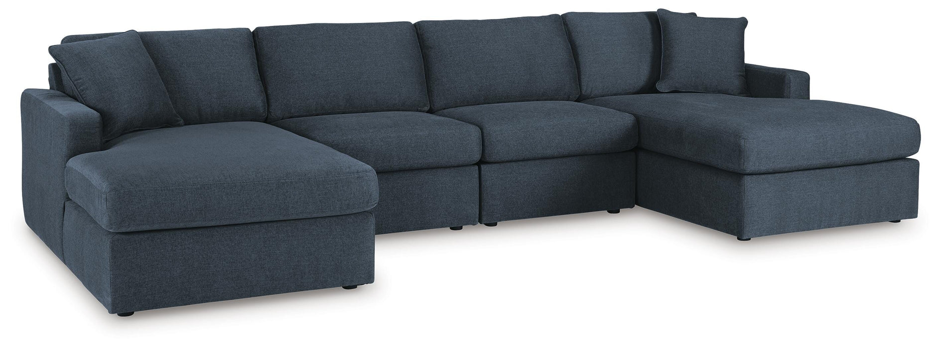 Ashley Furniture Modmax sectional with chaise, featuring plush cushions and modern design, shown in a stylish living room setting.