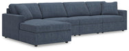 Ashley Furniture Modmax sectional with chaise featuring plush cushions and modern design in a neutral fabric.