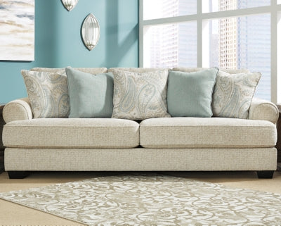 Ashley Furniture Monaghan sofa with plush fabric and modern design, shown in a cropped image highlighting cushions and armrests.