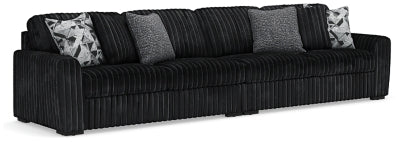 Midnight-Madness sectional sofa by Ashley Furniture, dark fabric with plush cushions and modern design in a living room setting