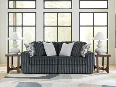 Ashley Furniture Midnight-Madness sectional sofa with plush cushions and modern design, shown in a stylish living room setting.