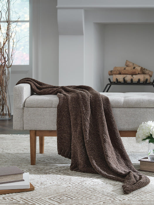 Ashley Furniture Anawood throw blanket with a cozy, woven design, perfect for adding warmth and style to any living space.