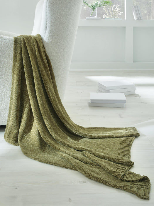 Ashley Furniture Anawood throw blanket, soft woven textile with a textured pattern, displayed folded on a neutral background.