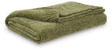 Ashley Furniture Anawood throw blanket featuring a cozy, textured fabric in earthy tones, perfect for adding warmth to your living space.