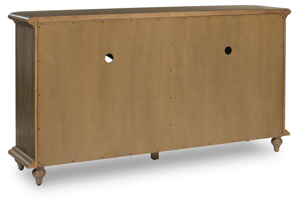Ashley Furniture Barlomore accent cabinet with sleek wooden finish and modern design, shown from the back view.