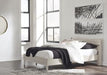 Ashley Furniture Socalle Panel Bed with a sleek wooden frame and modern design, shown in a well-lit bedroom setting.