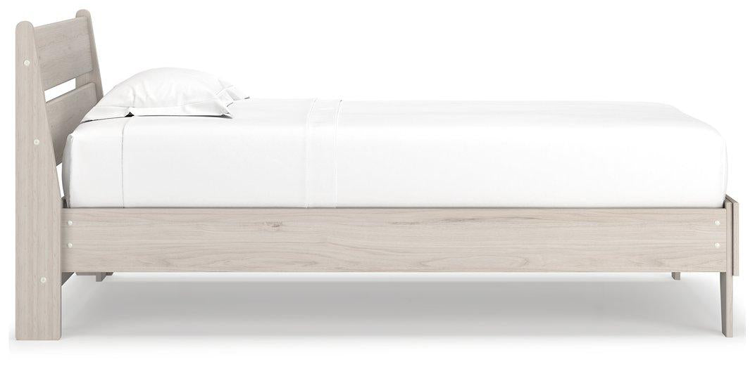 Ashley Furniture Socalle Panel Bed with sleek wood frame and modern design, shown in a bedroom setting.