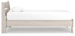 Ashley Furniture Socalle Panel Bed with sleek wood frame and modern design, shown in a bedroom setting.