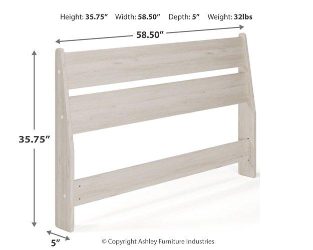 Ashley Furniture Socalle Panel Bed with a modern design, featuring a wooden headboard and sturdy frame in a natural wood finish.