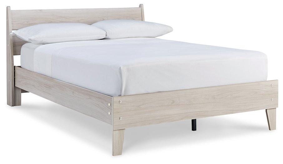 Ashley Furniture Socalle Panel Bed with a modern wooden frame and clean design, shown in a well-lit bedroom setting.