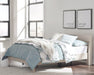 Ashley Furniture Socalle Panel Bed with a sleek wooden frame and modern design, shown in a bedroom setting.