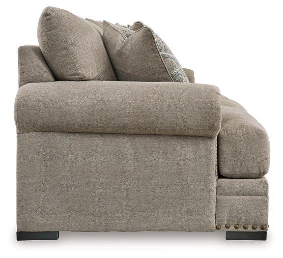 Ashley Furniture Galemore Sofa with plush cushions and neutral fabric, showcasing a modern living room style.