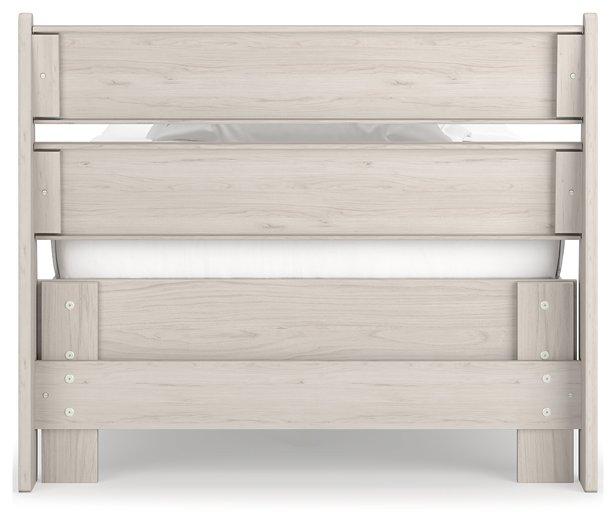 Ashley Furniture Socalle Panel Bed with a wood finish, featuring a classic headboard and sturdy frame for a stylish bedroom.