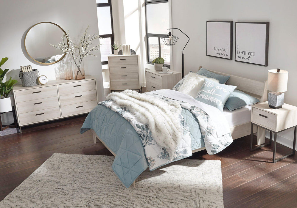 Ashley Furniture Socalle Panel Bed with a sleek wooden frame and headboard, showcasing a modern bedroom design.