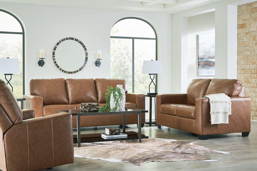 Ashley Furniture Bolsena living room set with sofa, armchair, and coffee table in a modern living space.