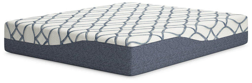 14-inch California King Chime Elite 2.0 mattress by Ashley Furniture with layered design and plush surface, shown in a well-lit bedroom setting.