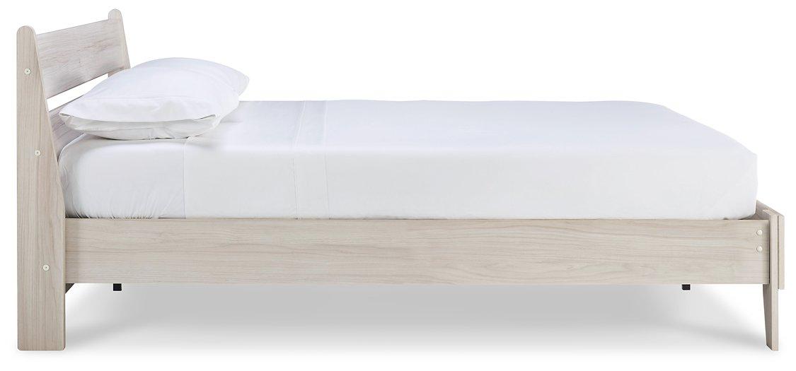 Ashley Furniture Socalle Panel Bed with a sleek wooden frame and headboard, showcasing a modern bedroom design.