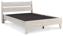 Ashley Furniture Socalle Panel Bed with a wooden frame and headboard, shown in a modern bedroom setting.