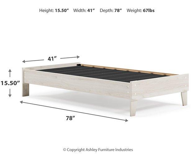 Ashley Furniture Socalle Panel Bed with a sturdy wooden frame and modern design, shown in a cozy bedroom setting.