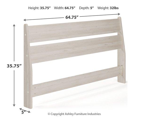 Ashley Furniture Socalle Panel Bed with a modern wooden frame and sleek headboard design, shown in a cozy bedroom setting.